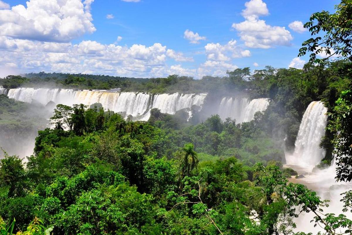 a view of a waterfall in the jungle