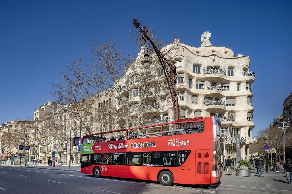 a red double decker bus parked in front of a building