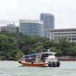 a group of people on a boat in the water