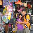 a man and a woman standing in front of a store