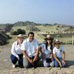 a family posing for a picture at the pyramids