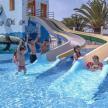 a group of children playing in a water park