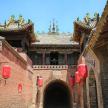 an entrance to a building with red lanterns