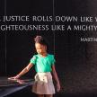 a little girl standing on a table with a quote