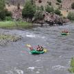 a group of people are rafting down a river