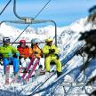 a group of people sitting on a ski lift