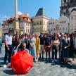 a large group of people standing in front of a castle
