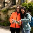 a man and a woman looking at a map