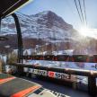 a tram with a view of a snow covered mountain