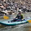 a man in a kayak on a river