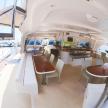 a dining room and kitchen inside of a boat