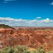 a view of the desert with red rocks