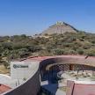 a building with a pyramid in the background