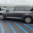 a silver van parked in a parking lot