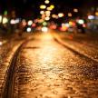 a wet street at night with lights