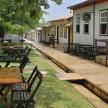 a group of tables and chairs on a street