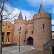 a large brick castle with two towers on a building