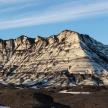 a mountain with snow on it in the desert