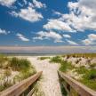 a path through the sand on a beach