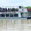 a boat with people on it on the water
