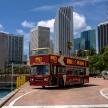 a double decker bus parked in front of a city
