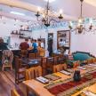a restaurant with people sitting at tables in a room