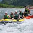 a group of people in a raft on a river