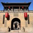 a building with two red lanterns on top of it
