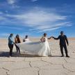 a group of people posing for a picture in the desert