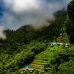 a view of a mountain with houses on a hill