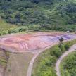 an aerial view of a mountain with a road