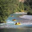 a group of people are rafting down a river