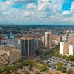 an aerial view of a city with tall buildings