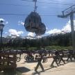 a group of people riding bikes on a ski lift