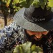 a man with a beard wearing a hat
