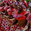 a group of women dressed in red and white