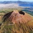 an aerial view of a mountain with the ocean