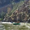 a group of people in a raft on a river