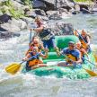 a group of people are rafting on a river