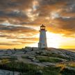 a lighthouse sitting on top of a rocky island