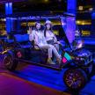 two women sitting in a golf cart at night