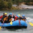 a group of people in a raft on a river