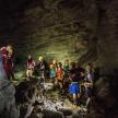 a group of people standing in a cave