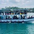 a boat with people on it in the water