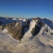 an aerial view of a snow covered mountain