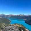 an aerial view of a blue lake in the mountains