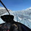 a view from the cockpit of a plane flying over a glacier