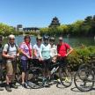 a group of people posing for a picture with their bikes