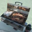 a grill with food cooking on top of the water