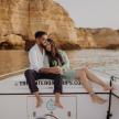 a man and a woman sitting on a boat